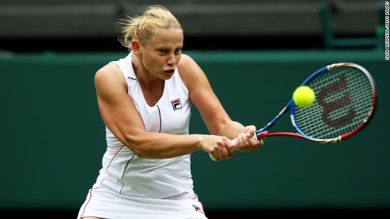 LONDON, ENGLAND - JUNE 20:  Jelena Dokic of Australia returns a shot during her first round match against Francesca Schiavone of Italy on Day One of the Wimbledon Lawn Tennis Championships at the All England Lawn Tennis and Croquet Club on June 20, 2011 in London, England.  (Photo by Clive Brunskill/Getty Images)